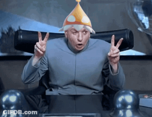 A Man Wearing A Party Hat Giving The Peace Sign GIF