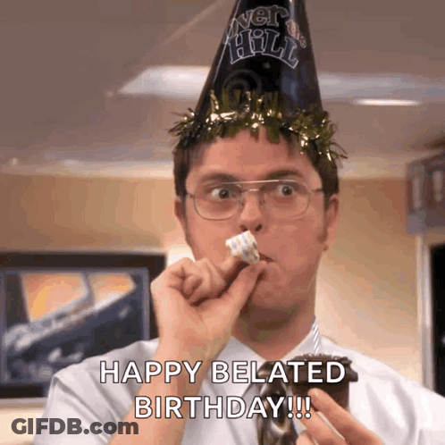 A Man Wearing A Party Hat Is Eating A Cake And Saying Happy Belated Birthday !!! GIF