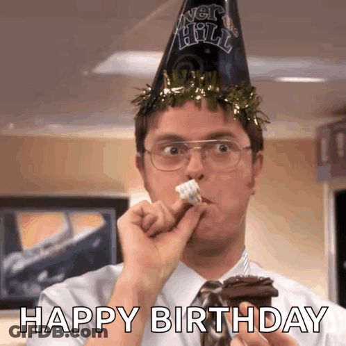 A Man Wearing A Party Hat Is Eating A Piece Of Cake With The Words Happy Birthday Written Below Him GIF