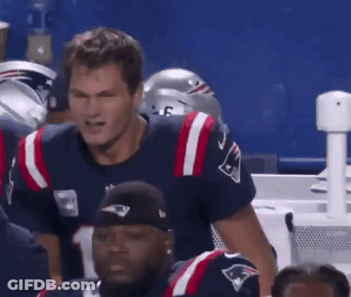 A Man Wearing A Patriots Jersey Stands In A Huddle GIF