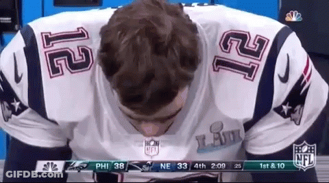 A Man Wearing A Patriots Jersey With The Number 12 On The Back GIF