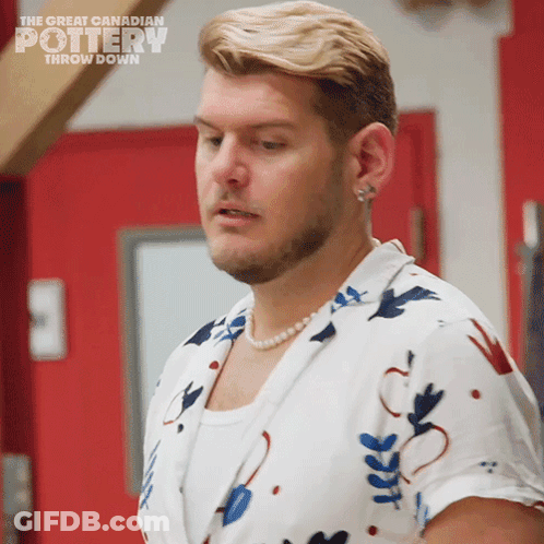 A Man Wearing A Pearl Necklace Is Featured On The Great Canadian Pottery Throw Down Show GIF