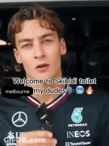 A Man Wearing A Petronas Shirt Says Welcome To Skibidi Toilet GIF