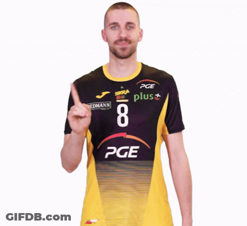 A Man Wearing A Pge Plus Shirt Points Upwards GIF