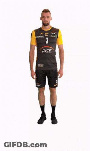 A Man Wearing A Pge Shirt And Shorts GIF