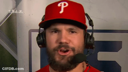 A Man Wearing A Phillies Hat And Headphones GIF