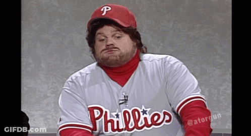A Man Wearing A Phillies Jersey And A Red Cap GIF