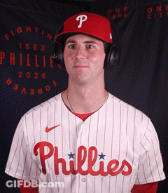A Man Wearing A Phillies Jersey And Headphones GIF