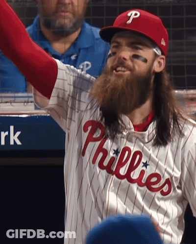A Man Wearing A Phillies Jersey With A Beard GIF