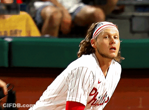 A Man Wearing A Phillies Jersey With A Headband On GIF