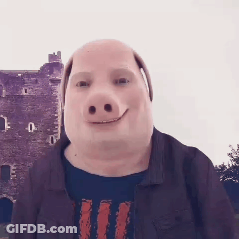 A Man Wearing A Pig Mask Is Smiling In Front Of A Building . GIF