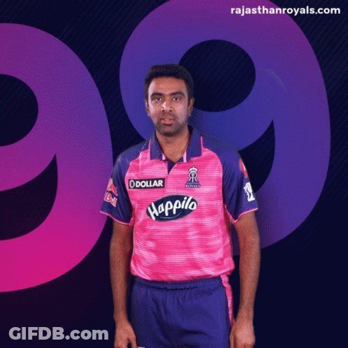 A Man Wearing A Pink And Purple Jersey With Happilo On It GIF
