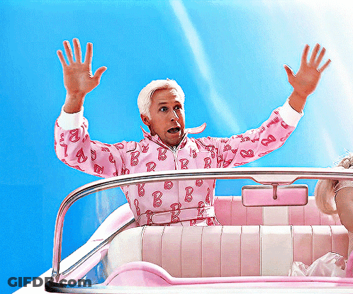 A Man Wearing A Pink Barbie Jacket Is Sitting In A Pink Car GIF