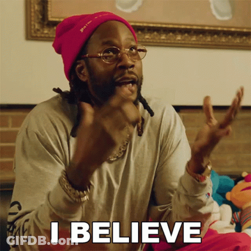A Man Wearing A Pink Beanie And Glasses Is Saying I Believe GIF
