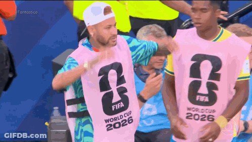 A Man Wearing A Pink Fifa World Cup 2026 Vest GIF