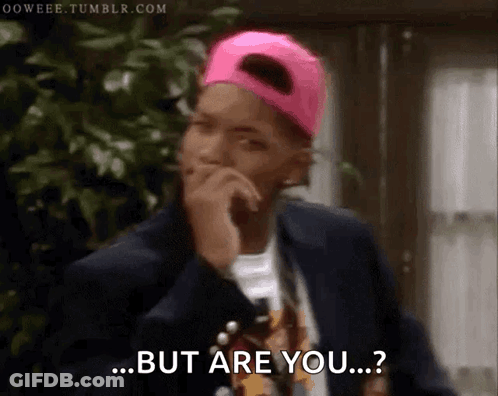 A Man Wearing A Pink Hat And A Suit Says But Are You GIF