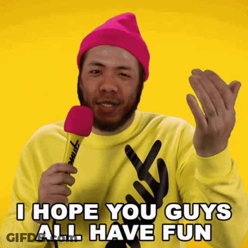A Man Wearing A Pink Hat And A Yellow Sweater Holds A Pink Microphone And Says I Hope You Guys All Have Fun GIF
