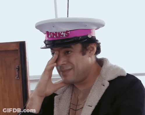 A Man Wearing A Pink Hat That Says Pink 'S On It GIF