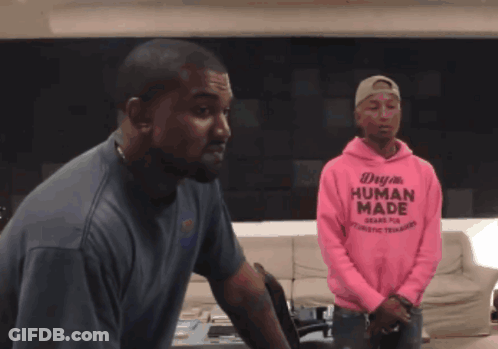 A Man Wearing A Pink Hoodie That Says Human Made On It GIF