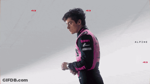A Man Wearing A Pink Jacket With The Name Franco Colapi GIF