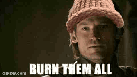 A Man Wearing A Pink Knitted Hat Is Holding A Gun And Saying `` Burn Them All '' . GIF