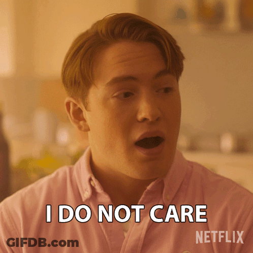 A Man Wearing A Pink Shirt Says I Do Not Care GIF
