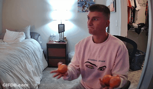 A Man Wearing A Pink Shirt That Says Eternal State GIF