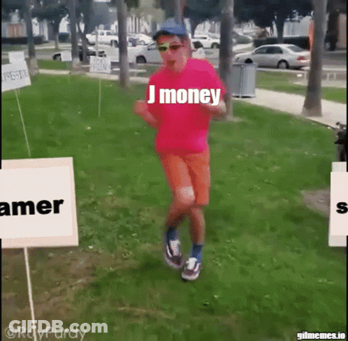 A Man Wearing A Pink Shirt That Says J Money Is Running In A Park GIF