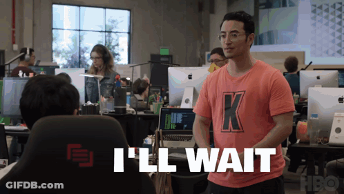 A Man Wearing A Pink Shirt With The Letter K On It GIF