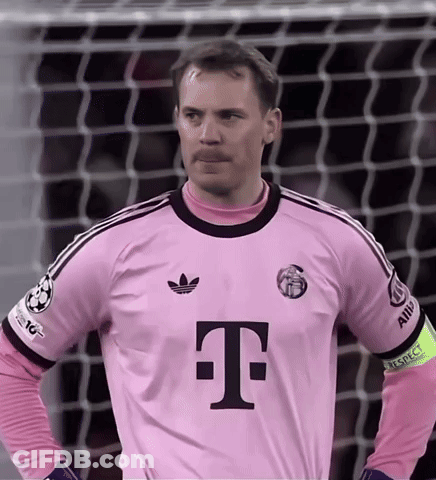 A Man Wearing A Pink T-Mobile Jersey Stands In Front Of A Goal GIF