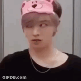 A Man Wearing A Pink Teddy Bear Hat And A Black Shirt . GIF