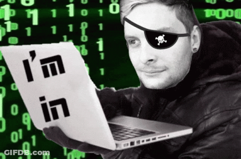 A Man Wearing A Pirate Eye Patch Holds A Laptop And A Piece Of Paper That Says I 'M In GIF
