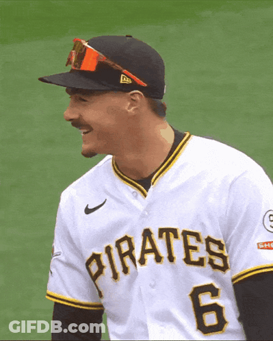 A Man Wearing A Pirates Jersey And Sunglasses Smiles GIF