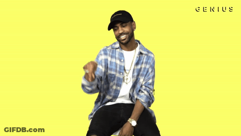 A Man Wearing A Plaid Shirt And A Black Hat With The Word Genius On The Bottom Right GIF