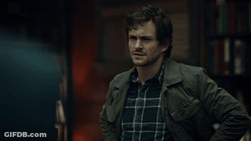 A Man Wearing A Plaid Shirt And A Green Jacket GIF