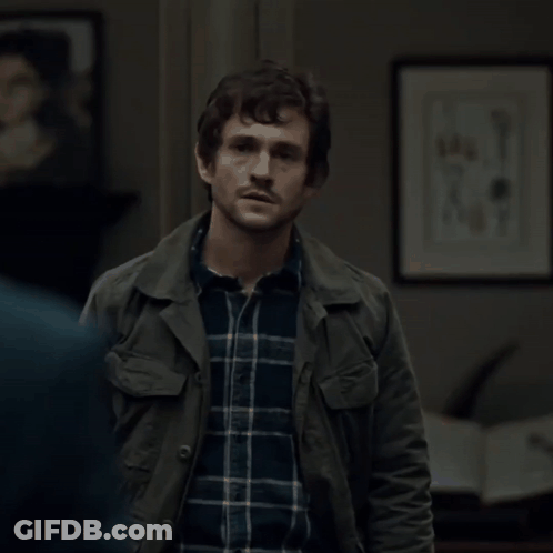 A Man Wearing A Plaid Shirt And A Green Jacket GIF