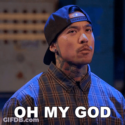 A Man Wearing A Plaid Shirt And A Hat Says " Oh My God " GIF