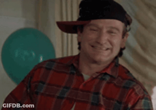 A Man Wearing A Plaid Shirt And A Hat Says Wazzup . GIF