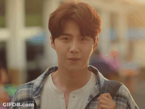 A Man Wearing A Plaid Shirt And A White Shirt Is Carrying A Backpack GIF