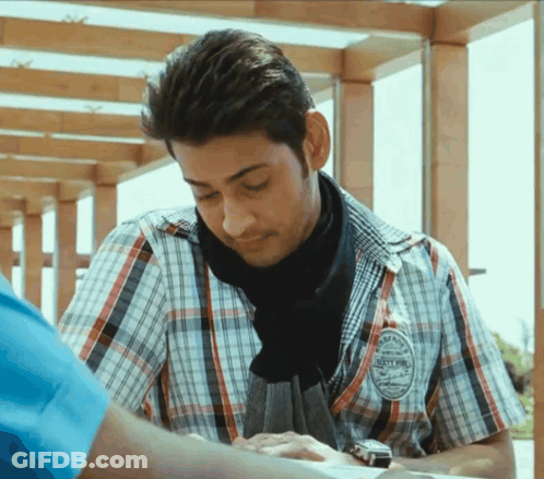 A Man Wearing A Plaid Shirt Has A Badge On His Sleeve That Says ' Sydney ' On It GIF