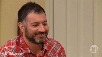 A Man Wearing A Plaid Shirt Is Asking Who Are You GIF