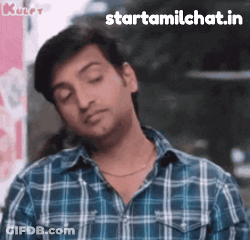 A Man Wearing A Plaid Shirt Is Making A Funny Face With The Words Starttamilchat.in Written Below Him GIF