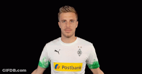 A Man Wearing A Postbank Shirt Holds His Arms Out GIF