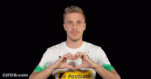 A Man Wearing A Postbank Shirt Making A Heart Shape With His Hands GIF