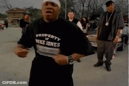 A Man Wearing A Property Of Mike Jones Shirt GIF
