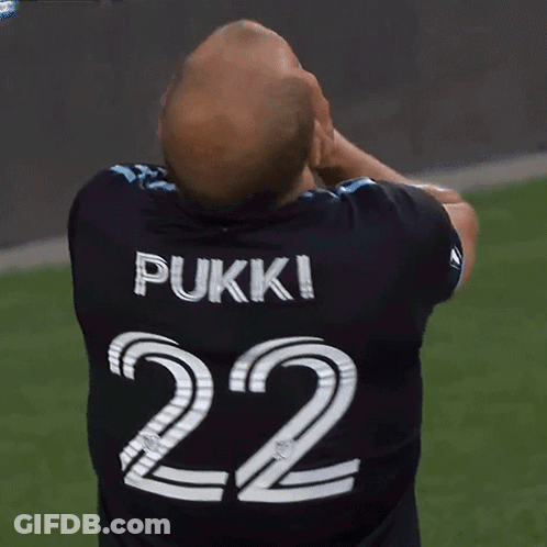 A Man Wearing A Pukki 22 Jersey Covers His Face GIF