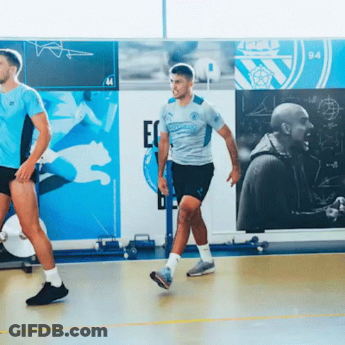 A Man Wearing A Puma Jersey Is Walking On A Basketball Court GIF