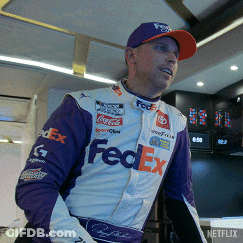 A Man Wearing A Purple And White Fedex Outfit GIF