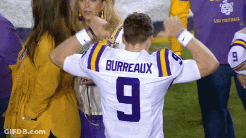 A Man Wearing A Purple And Yellow Jersey With The Name Burreaux On The Back GIF