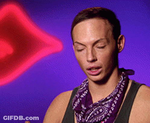 A Man Wearing A Purple Bandana Is Standing In Front Of A Purple Background GIF